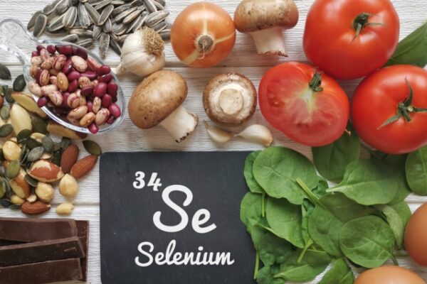 Food rich in selenium, with the symbol Se and atomic number 34 for the chemical element selenium. Natural healthy sources of selenium. Spinach, dark chocolate, egg, mushroom, bean, garlic, seeds, nuts